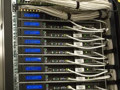 Rows of specialized servers inside a modern data center