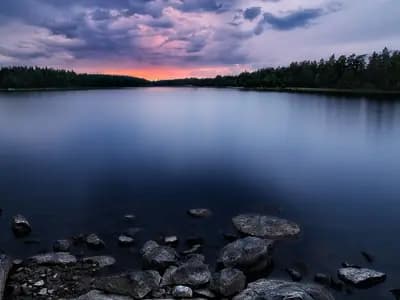 Travelers enjoying a cool forest lake during summer
