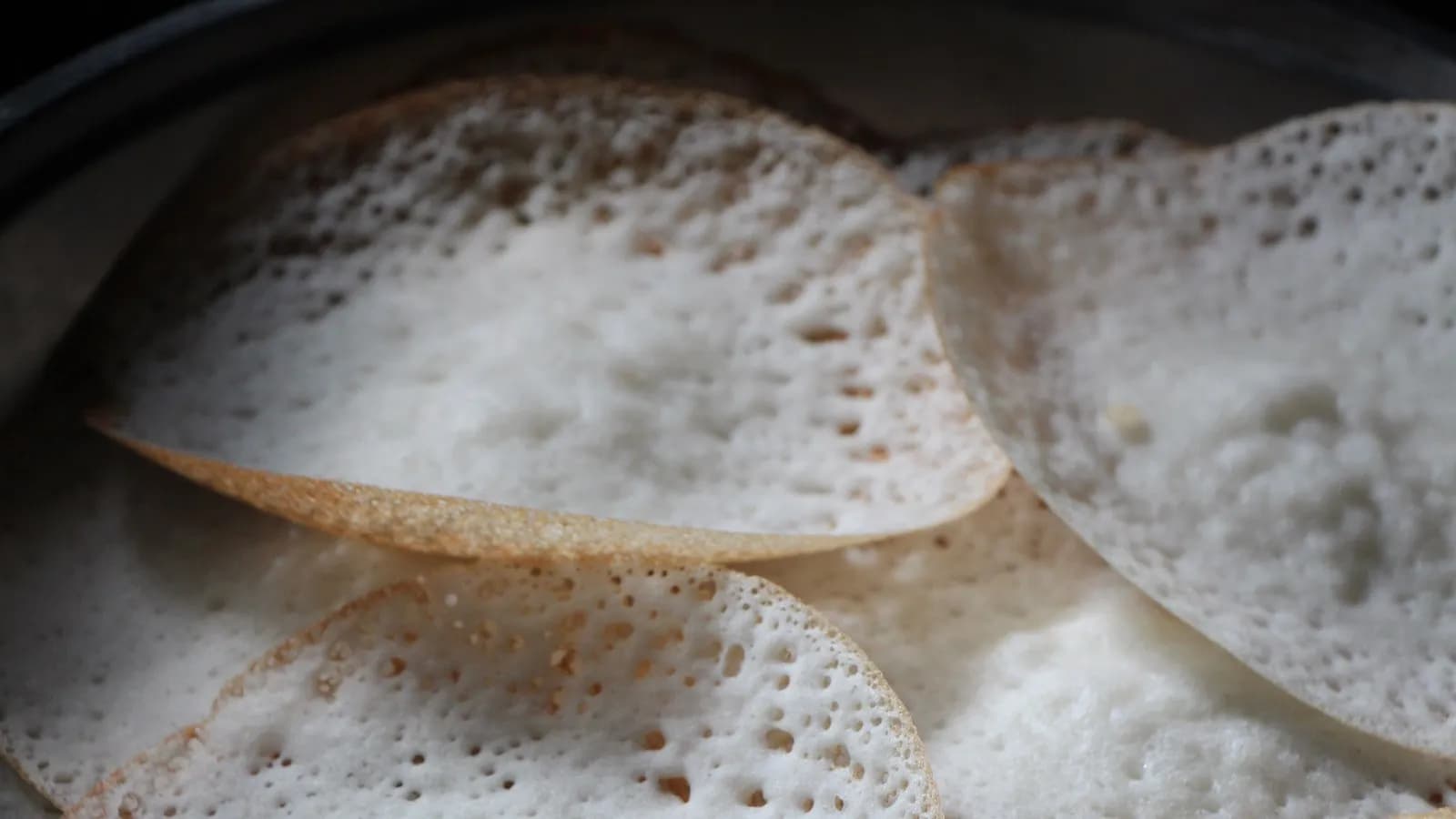 Appam, the fermented rice and coconut pancakes with lacy edges and a soft centre, which is what ishtu is traditionally eaten with