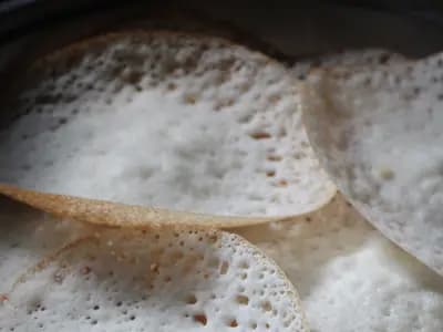Appam, the fermented rice and coconut pancakes with lacy edges and a soft centre, which is what ishtu is traditionally eaten with