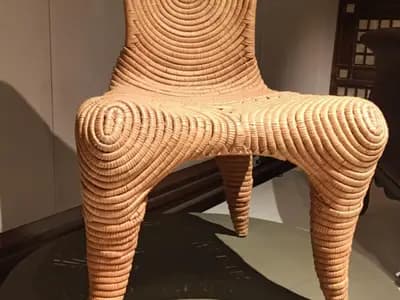 Handmade ceramic vessels arranged on a wooden shelf