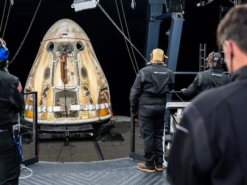 Support teams on the SpaceX recovery ship Shannon working around the Crew Dragon Endurance shortly after it landed with the Crew-5 astronauts, photographed on 11 March 2023, a file photograph of an earlier mission and not of the Crew-12 landing