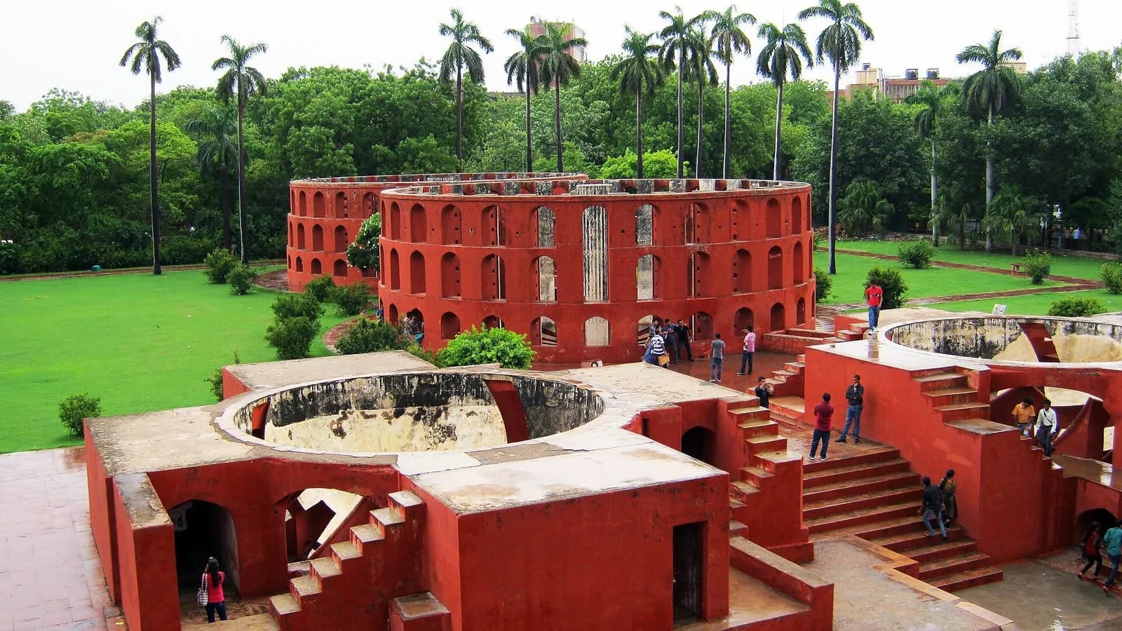 Red sandstone observatory instruments of the Jantar Mantar in New Delhi, with palm trees behind, photographed in July 2011, a file photograph of the site where the rally was planned and not of Saturday's lockdown or protest