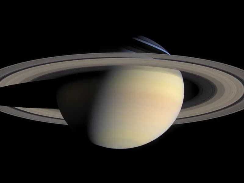 Saturn and its rings photographed by the Cassini spacecraft on 6 October 2004, illustrative of the mission whose archived data was reanalysed and not a new image of Enceladus itself