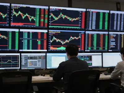 Market data screens showing price movements across several instruments