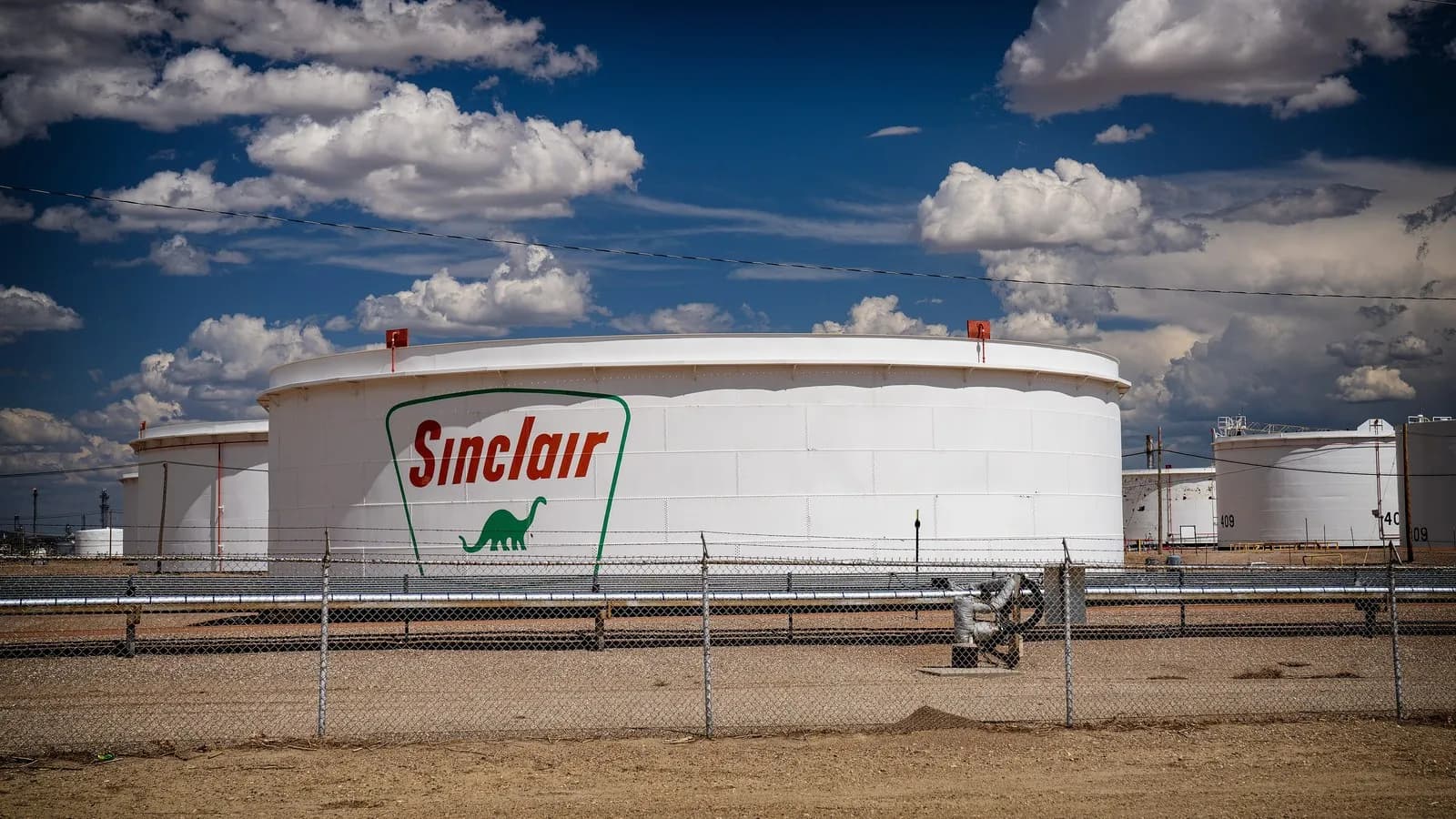 White oil storage tanks at a refinery in Wyoming, a file photograph taken in July 2025 that illustrates fuel storage and is not one of the reserve sites involved in the G7 release