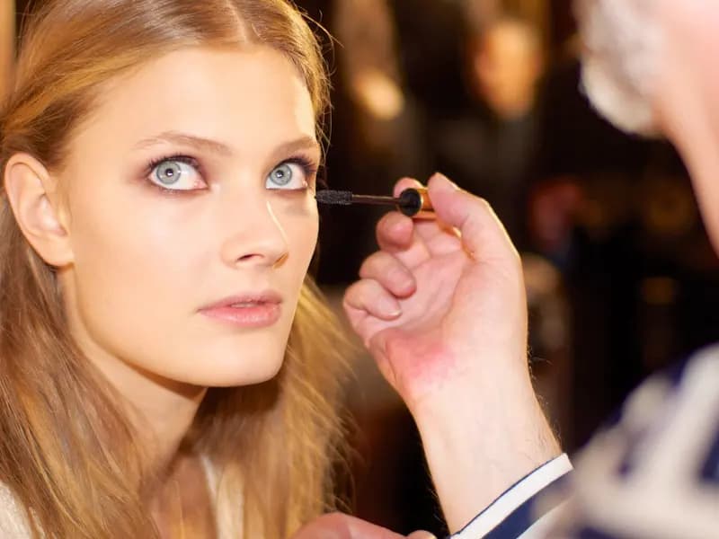 A model having her make-up finished backstage before a Zuhair Murad show in Paris. The house is a guest member of the haute couture calendar