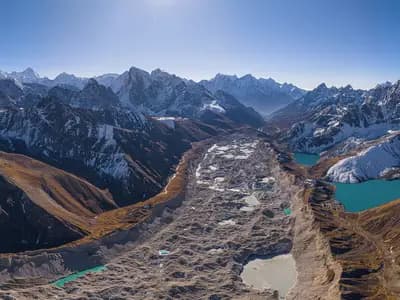The Ngozumpa glacier and the Gokyo lakes below the peaks of the Khumbu region in Nepal, seen from the air in June 2025