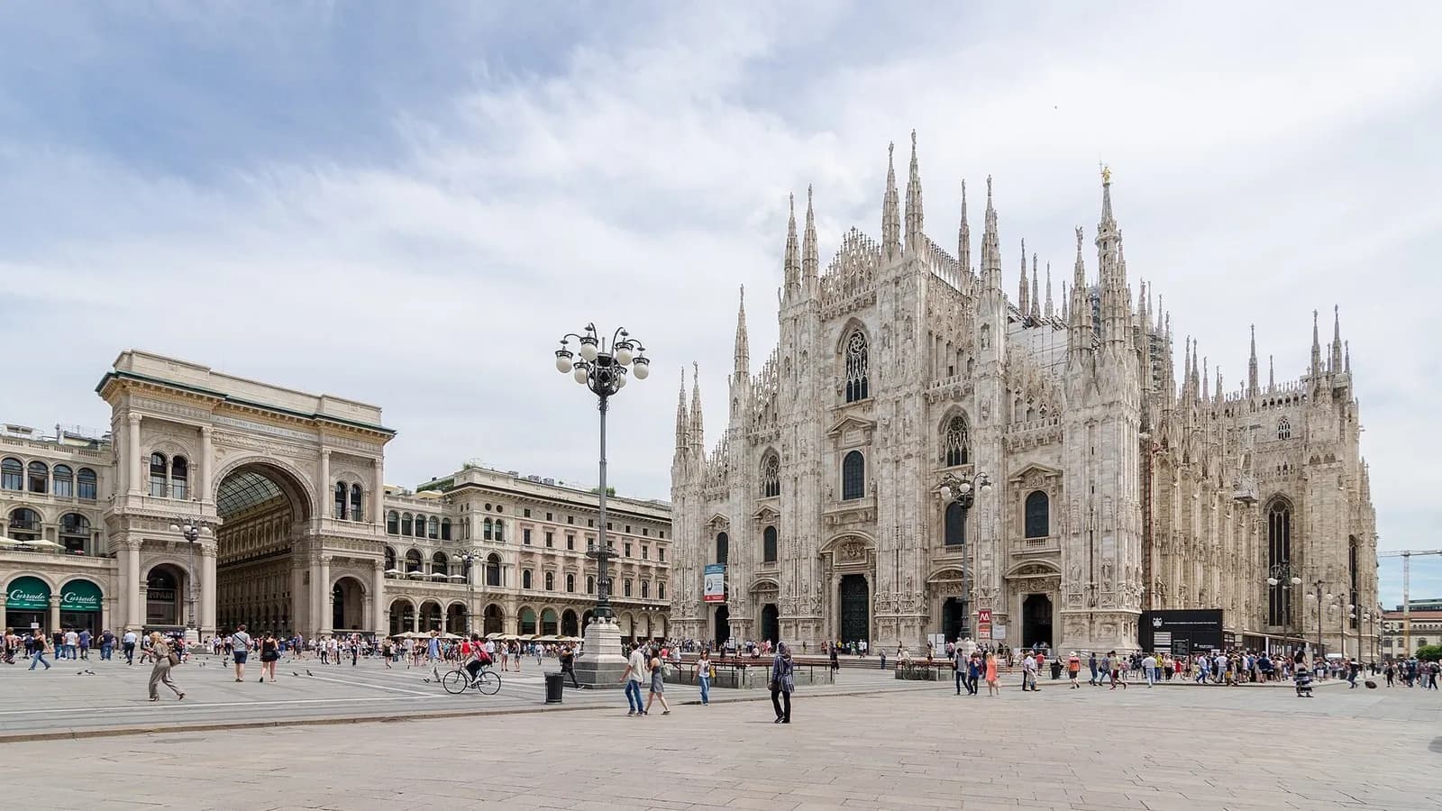 Milan Cathedral and the Piazza del Duomo with the arch of the Galleria Vittorio Emanuele II on the left and visitors crossing the square, photographed on 27 June 2016, a file photograph of the square and not from Saturday's protest