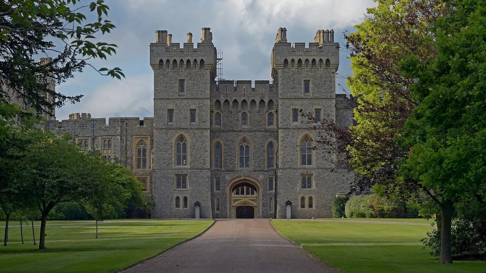 The King George IV Gate and towers of Windsor Castle seen along a tree-lined path, photographed on 4 June 2019, a file photograph of the castle and not from Tuesday's banquet