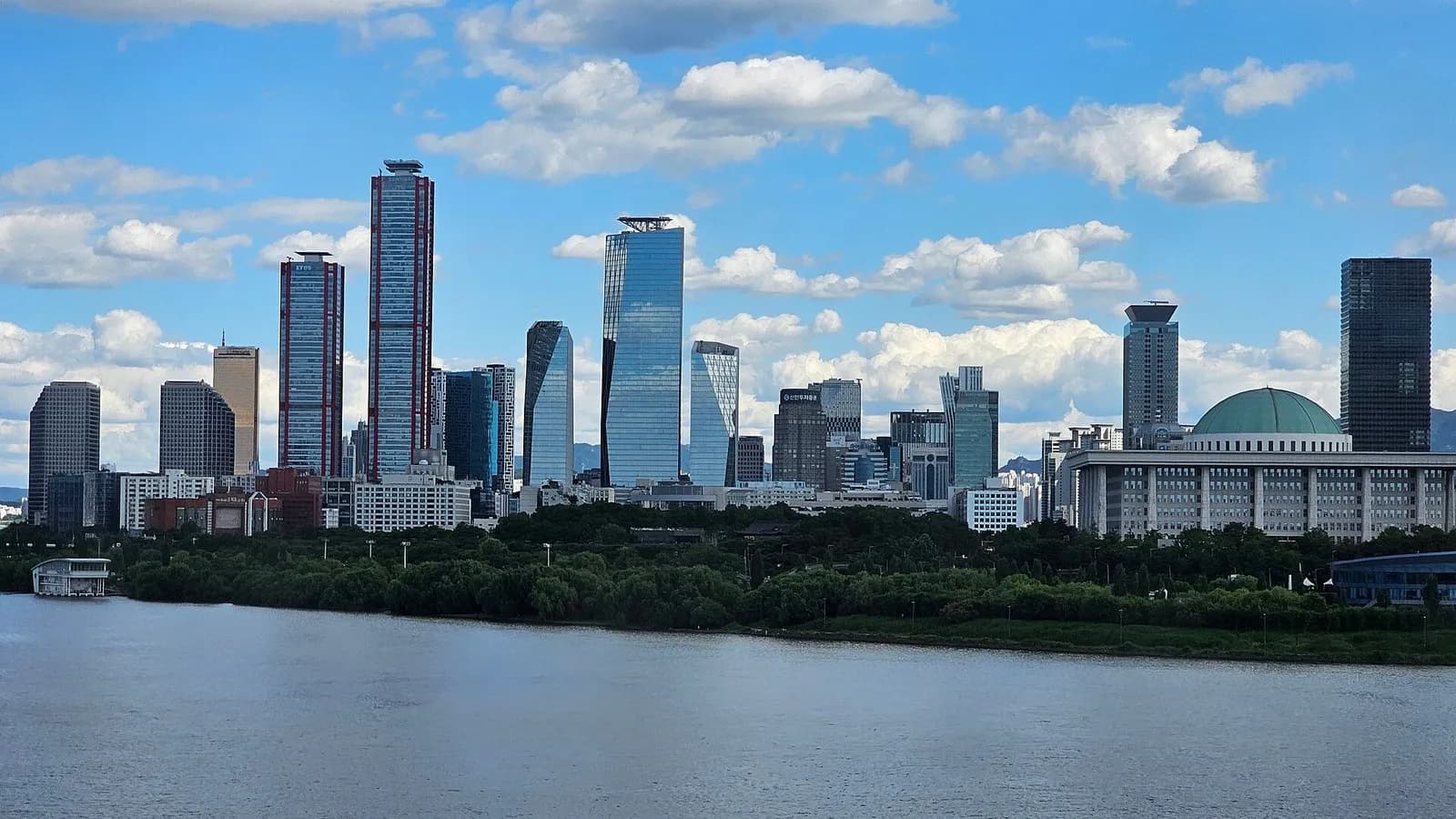 Skyscrapers of the Yeouido financial district in Seoul across the Han River, with the dome of the National Assembly building at right, photographed on 28 May 2024, a file photograph and not from Thursday's trading
