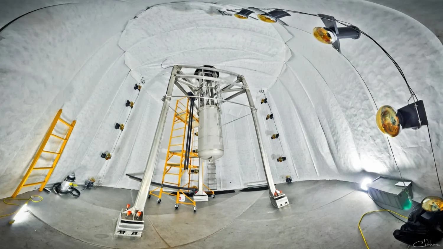 The LUX detector, LZ's predecessor, suspended inside its water tank 4,850 feet underground at the Sanford lab in South Dakota. LZ now occupies the same cavern with a far larger xenon vessel