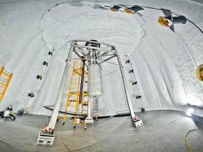 The LUX detector, LZ's predecessor, suspended inside its water tank 4,850 feet underground at the Sanford lab in South Dakota. LZ now occupies the same cavern with a far larger xenon vessel