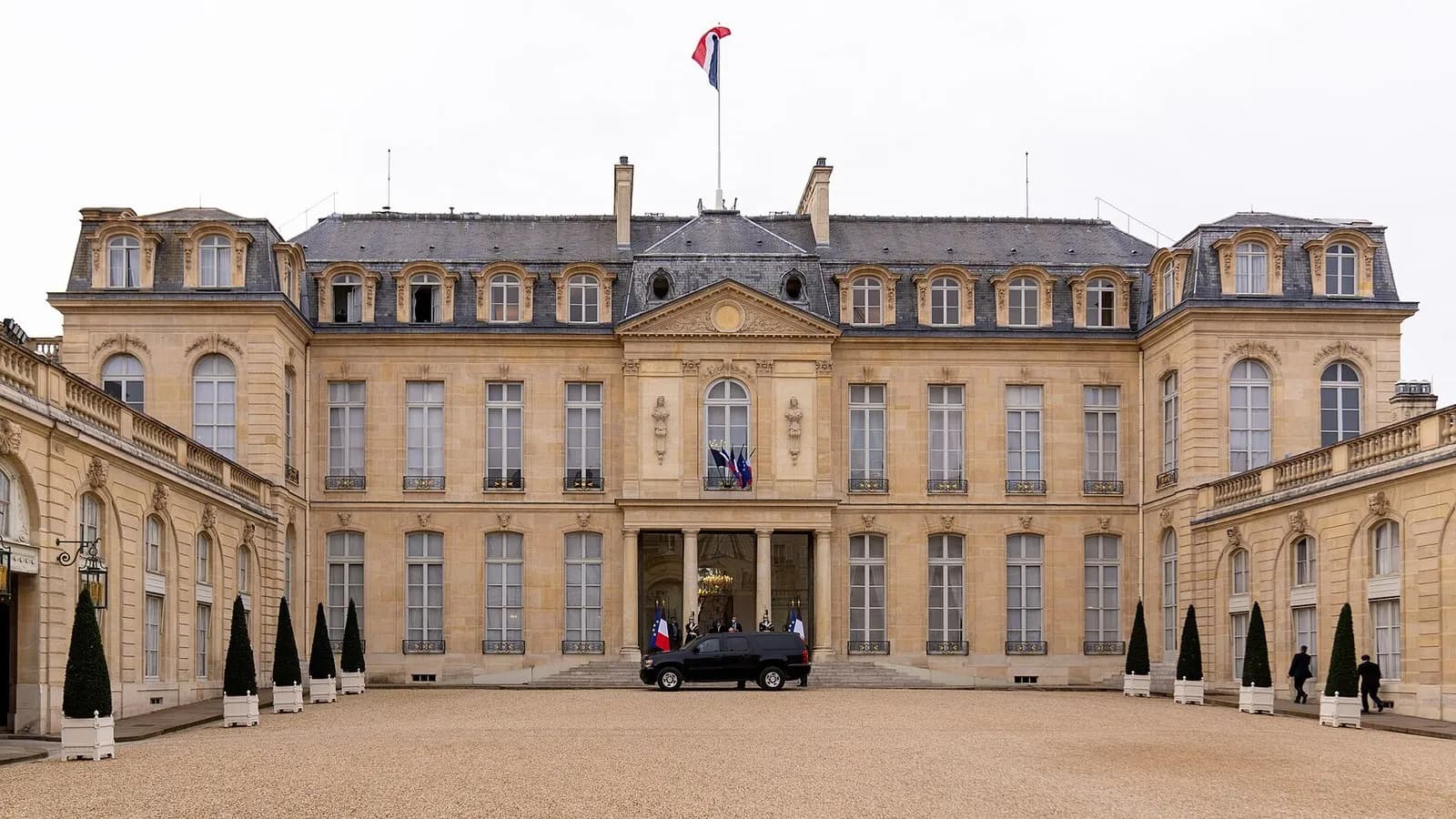 The front courtyard and main facade of the Elysee Palace in Paris with a French flag on the roof and a dark car by the steps, photographed on 16 November 2020, a file photograph of the presidential palace and not from this week's Gulf tour
