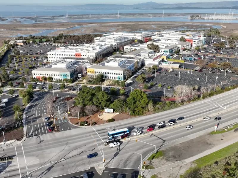 An aerial view of the white and coloured office buildings and car parks of the Meta campus beside San Francisco Bay at Menlo Park, photographed on 27 January 2023, a file photograph of the campus and not of this week's results
