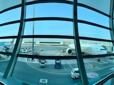 Aircraft at the gates seen from inside Terminal 3 at Dubai International Airport, photographed in 2019