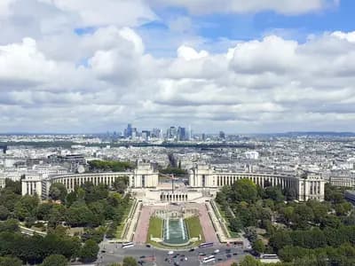 Paris seen from the Eiffel Tower, with the Trocadero in the foreground and the towers of La Defense on the horizon; Mistral is based in the city