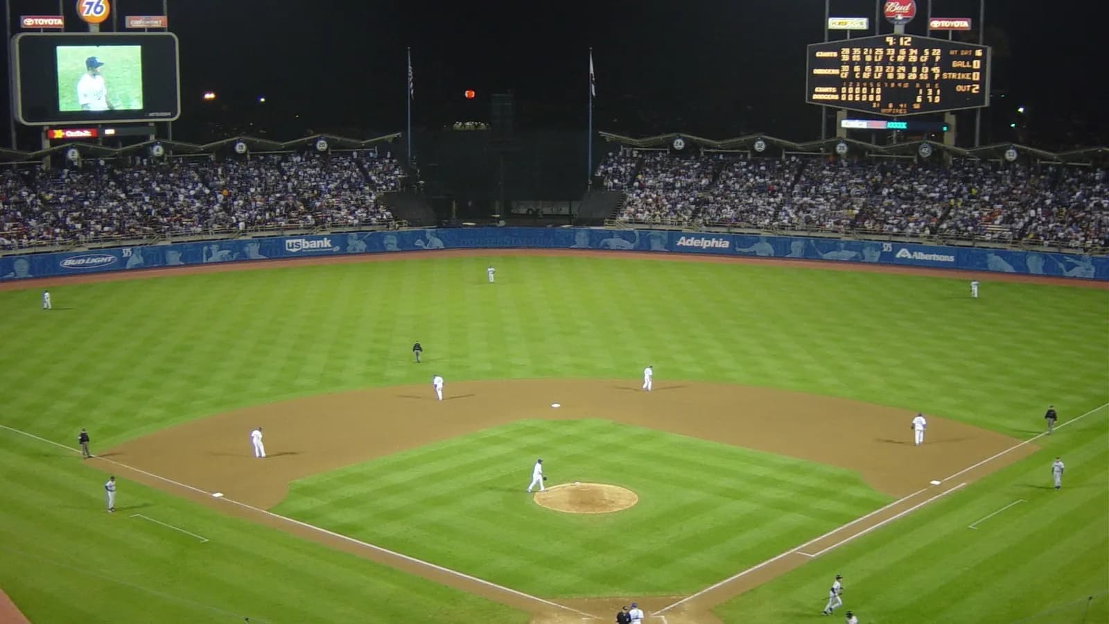 Dodger Stadium illuminated at night, illustrative of Major League Baseball postseason play and not a venue from this year's wild card round, photographed in September 2002