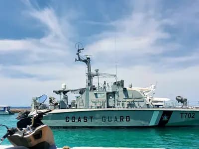 A Maldives maritime rescue team preparing diving equipment aboard a patrol vessel