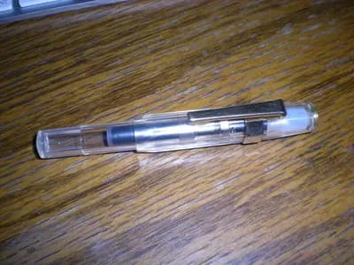 Two unbranded weekly injection pens placed side by side on a clinical white surface
