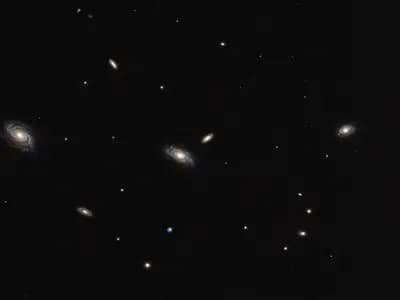 A wide field of sky scattered with distant galaxies of similar scale