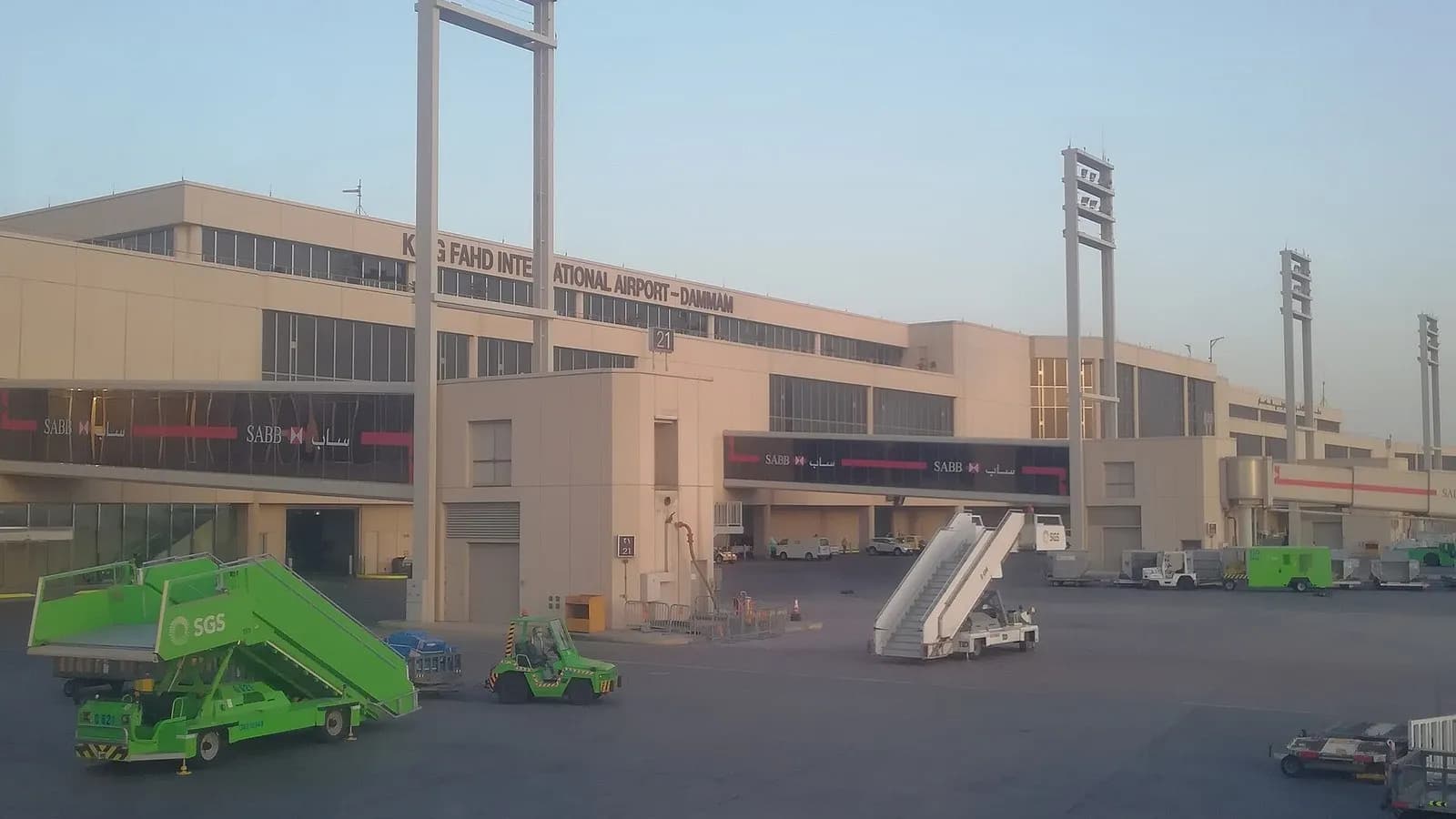 The passenger terminal of King Fahd International Airport in Dammam seen from the apron, with floodlight masts and ground-handling steps in the foreground, photographed on 13 March 2018, a file photograph of the airport and not of Wednesday's attack
