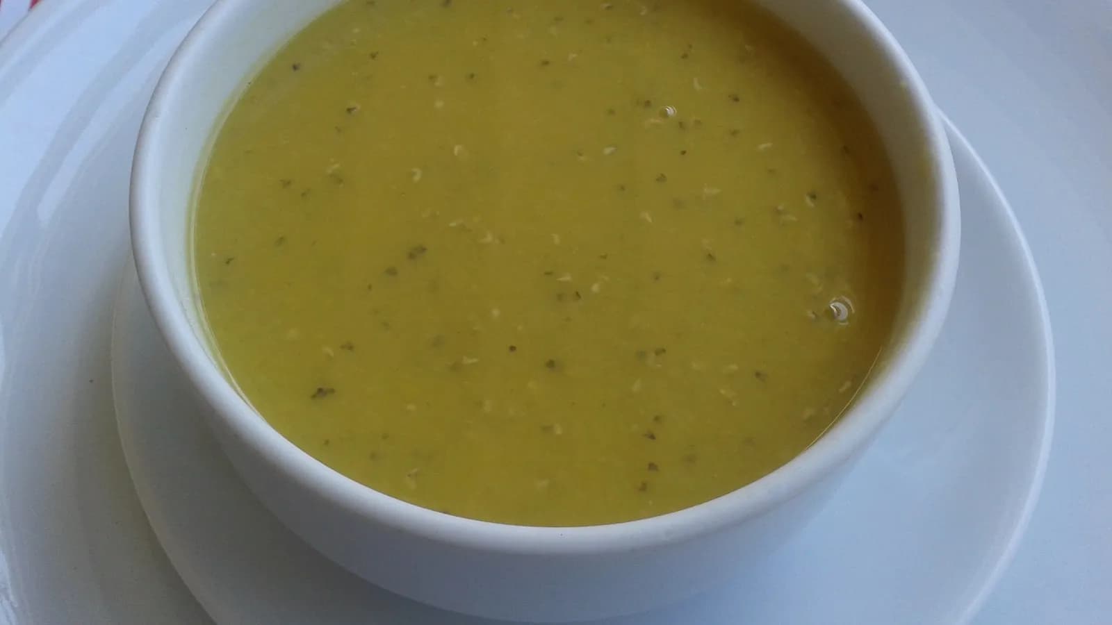 A bowl of red lentil soup, mercimek corbasi, as served in Turkey