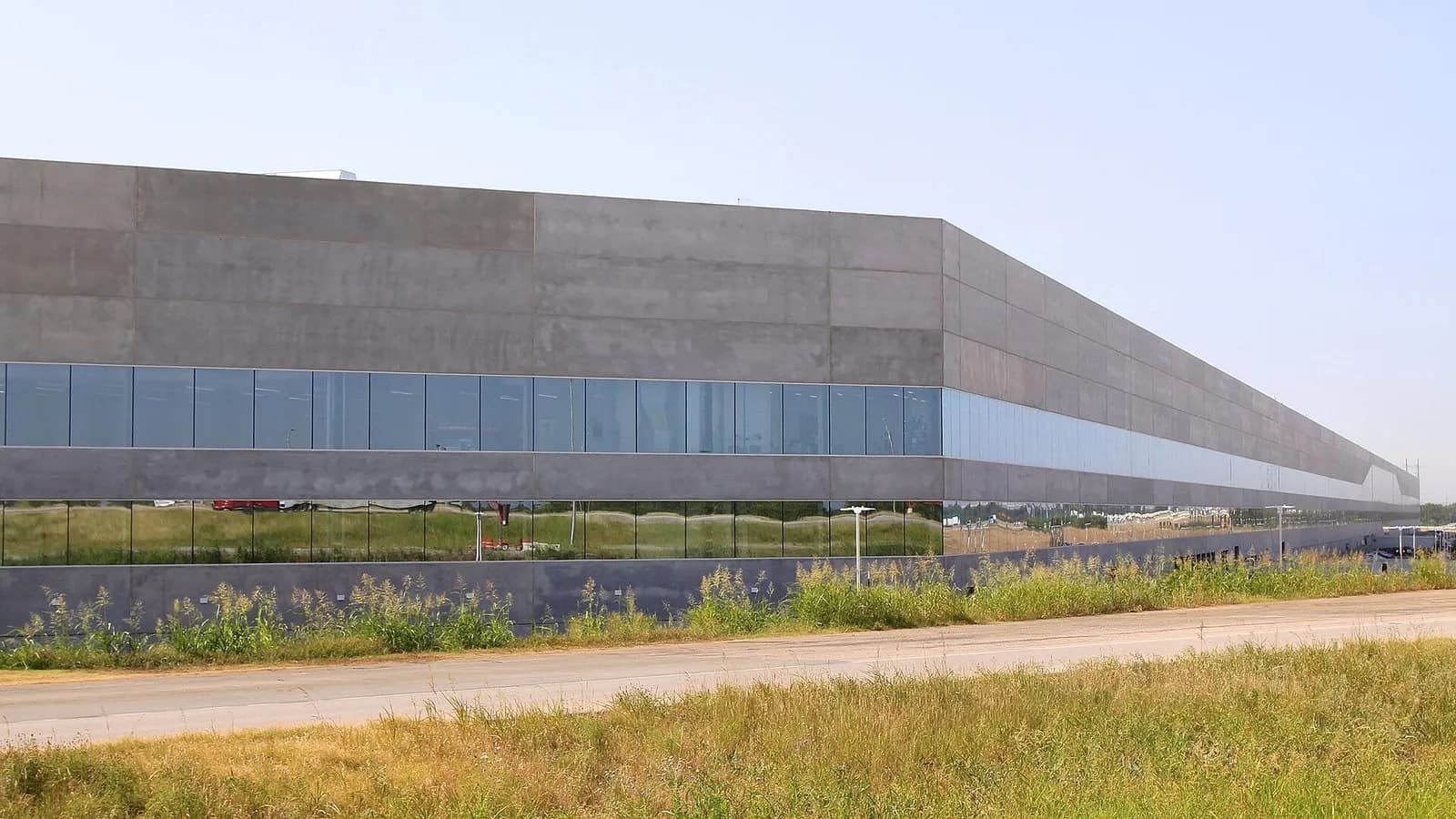 A long grey Tesla Gigafactory Texas building with a band of glass near Austin, photographed on 17 June 2022, a file photograph of the factory and not of this quarter's production