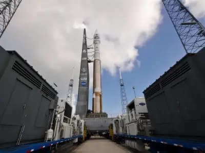 A rocket standing on a launch pad at dusk