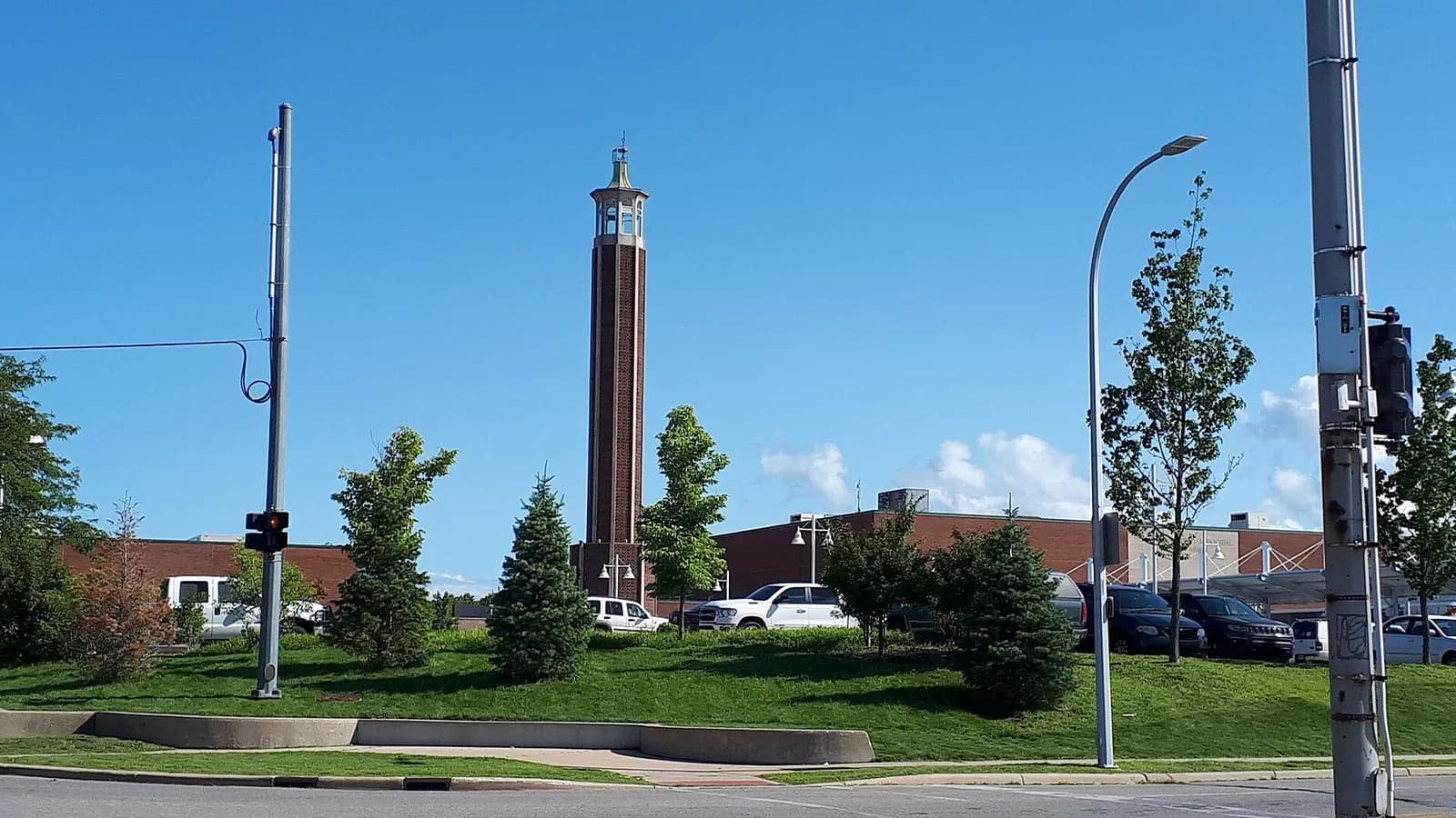 The brick tower at the McMorran Place complex in Port Huron, Michigan, rising above a lawn and car park under a blue sky, photographed on 23 August 2019, a file photograph of the venue and not of Sunday's rally