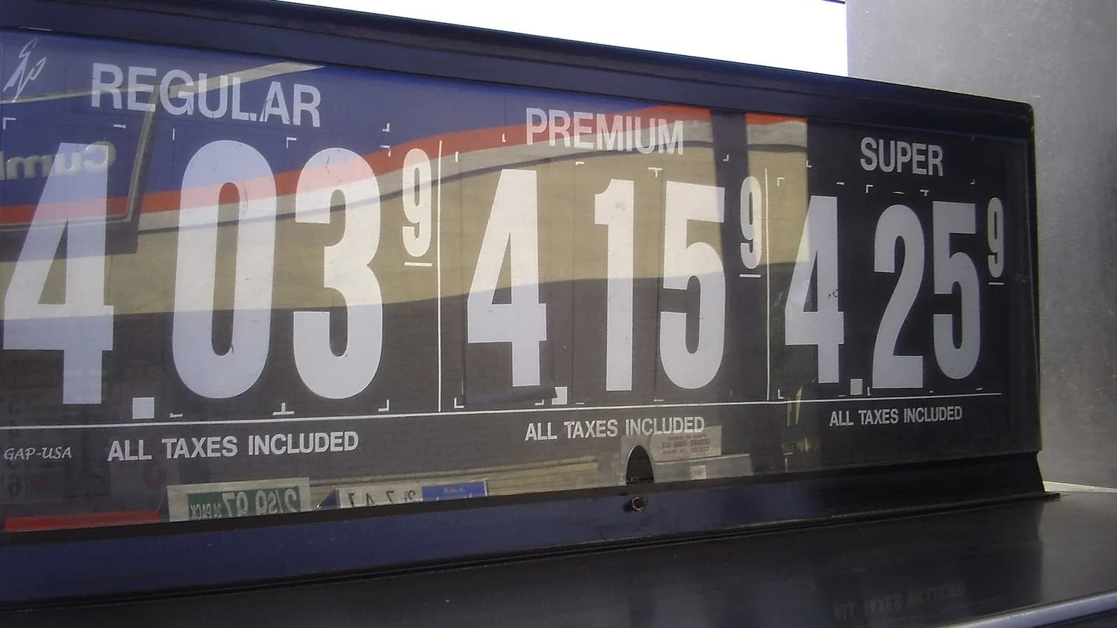 A gasoline price board reading $4.03, $4.15 and $4.25 for regular, premium and super at a Cumberland Farms station in Lewiston, Maine, an undated file photograph illustrative of US pump prices and not of September's inflation data