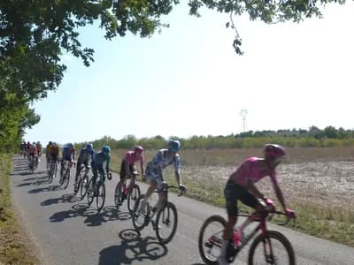 The chasing group strung out along a road on stage two of the 2026 Vuelta a Espana, between Esparron-de-Verdon and Greoux-les-Bains