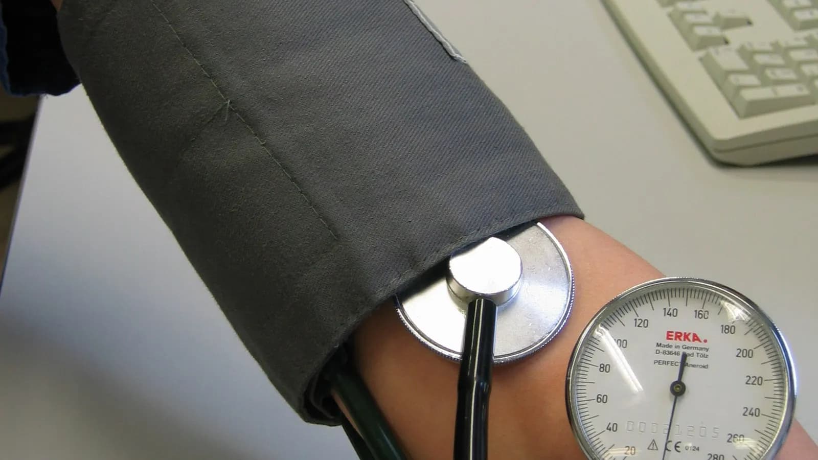 A blood pressure reading being taken on an upper arm with a cuff, an aneroid gauge and a stethoscope, photographed in 2009, a file photograph illustrative of routine blood pressure checks and not of any patient in this report