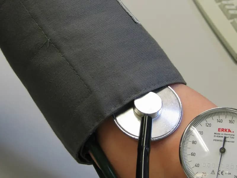A blood pressure reading being taken on an upper arm with a cuff, an aneroid gauge and a stethoscope, photographed in 2009, a file photograph illustrative of routine blood pressure checks and not of any patient in this report